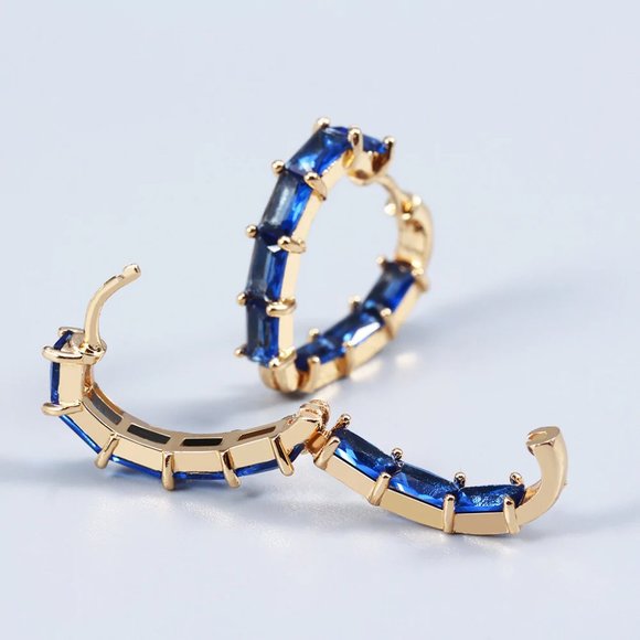 Blue crystal heart shaped earrings with gold base. - Picture 2 of 3